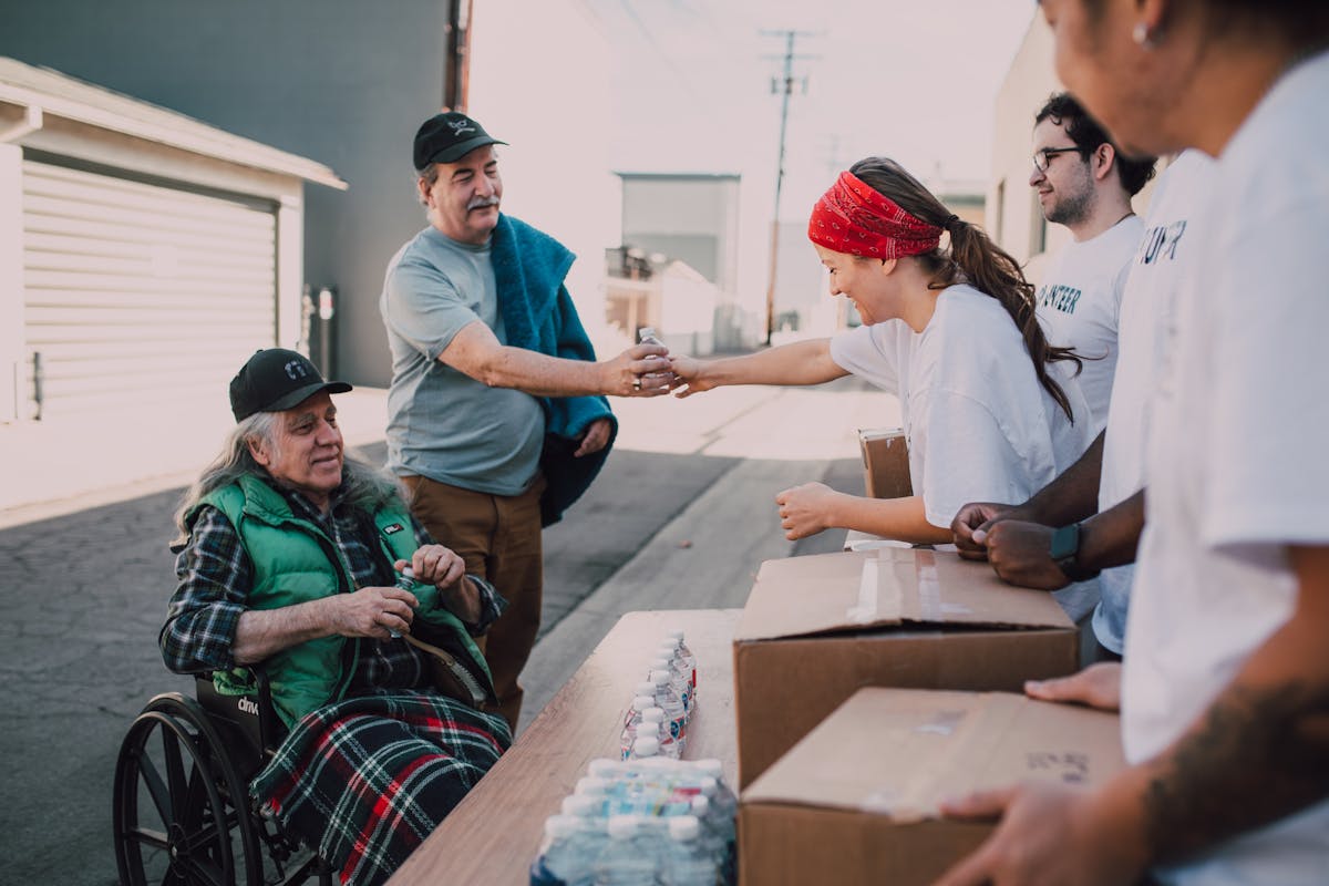 Volunteers giving donations and supporting community - VIQ Belleville