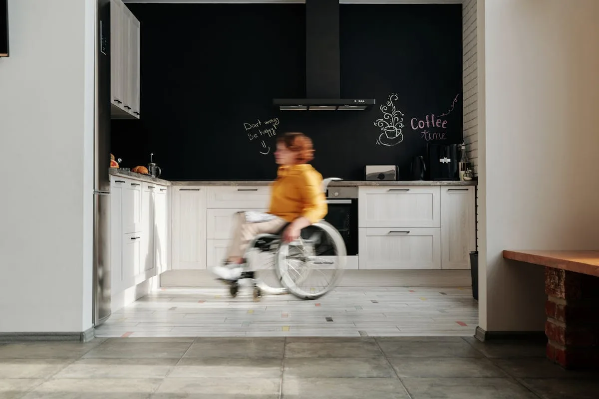 Woman using wheelchair in accessible modern home - adaptive home renovation Breelan Construction